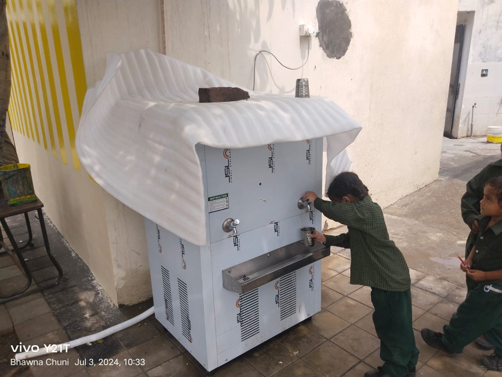 Clean drinking water cooler installation for students
